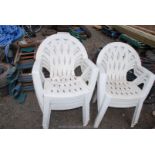 7 x white stacking garden chairs.