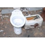 White W.C. pan and high-level cistern.