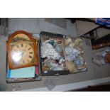 Three boxes of miscellaneous china dog figures, modern clock face,