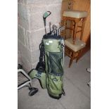 Part set of golf clubs in camping bag with irons and one wood,