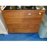 A chest of two short over three long bedroom drawers