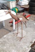 Metal work bird sculpture.