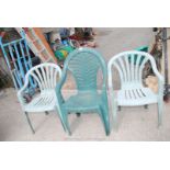 3 x green plastic patio chairs.