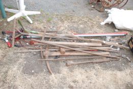 Large quantity of garden tools, pick axes, lopper, hose, steel bars, etc.