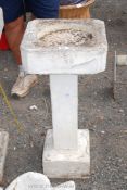 Bird bath with square column standing on a square base 32" high.