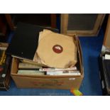 Box of books and HMV records.