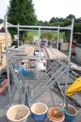 Quantity of 4' x 4' scaffold tower - 10 sections with safety bar boards and foot plates.