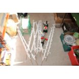 Electric fence kit, 10 plastic posts, coil of fencing tape.