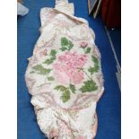 Large floral pattern throw and a circular rug with rose design.
