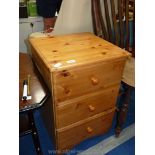 Pine three drawer bedroom cabinet, 27'' high x 18 1/2'' wide x 18'' deep.