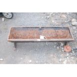 Cast iron pig feeder trough 4' long.