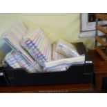 Box of new striped flannellete sheets and pillow cases