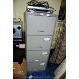 Four drawer metal filing cabinet.