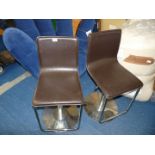 Pair of faux leather and chrome swivel chairs