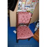 Bedroom chair with pink lustre upholstery