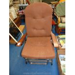 Brown covered sun lounger converts to armchair