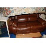 Two seater leather sofa and matching armchair, slightly worn on arms.