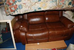 Two seater leather sofa and matching armchair, slightly worn on arms.