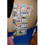 Collection of humorous postcards mounted on hardboard