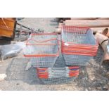 Large quantity of wire shopping baskets.