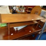 Teak coffee table with shelf.