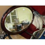 Oval shaped bevel edged mirror, 34'' x 24''.