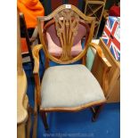 Carver chair with shield back and fleur de lys central splat.