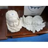 Cherub plaster wall mounted bust plus one.