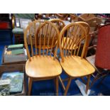 Set of four stick back dining chairs