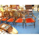 Set of 4 armed dining chairs.