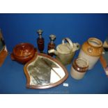 A quantity of items to include two storage jars, hot water can, candlesticks and mirror.