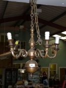 A five arm brass chandelier