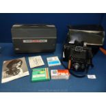 A Prinz Magnon Super IQ Twinsystem 8 mm projector and a Polaroid Colour Swinger Land camera.
