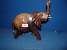 A carved African elephant, 11 high.