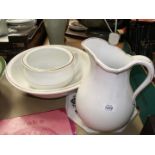 A large white wash bowl, jug and chamber pot with gold rim, small chip to bowl.