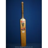 A Duncan Fearnley cricket bat.
