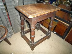 An Oak peg joyned Stool having solid seat and turned legs with perimeter stretchers,
