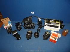 A Minolta camera, boxed Halina pocket camera, flash units. etc.