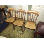 A part set of three Elm seated circa 1900 Kitchen Chairs having turned legs,