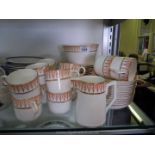 A pink and white ground Teaset with gilt border comprising twelve cups, saucers and side plates,