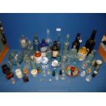 A large quantity of glass bottles and some pots, bottles to include Holbrook & Co,