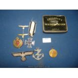 A small quantity of Medals including a 1957 replacement issue Iron Cross 2nd class,