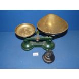 A pair of green scales with brass trays plus all weights.