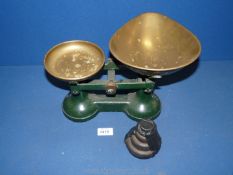 A pair of green scales with brass trays plus all weights.