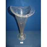 A large glass trumpet shape vase, 17" tall.