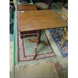 A Victorian snap-top rectangular Occasional Table having turned pillar and three splay feet,