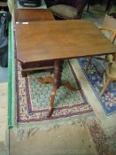 A Victorian snap-top rectangular Occasional Table having turned pillar and three splay feet,