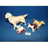 Four Beswick dogs including a Retriever, small Cocker Spaniel,