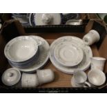 A quantity of stoneware dinner and tea ware including dinner and side plates, mugs, sugar bowl,