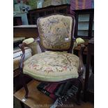 An elegant framed, broad seated Elbow Chair having cabriole front legs and swept rear legs,